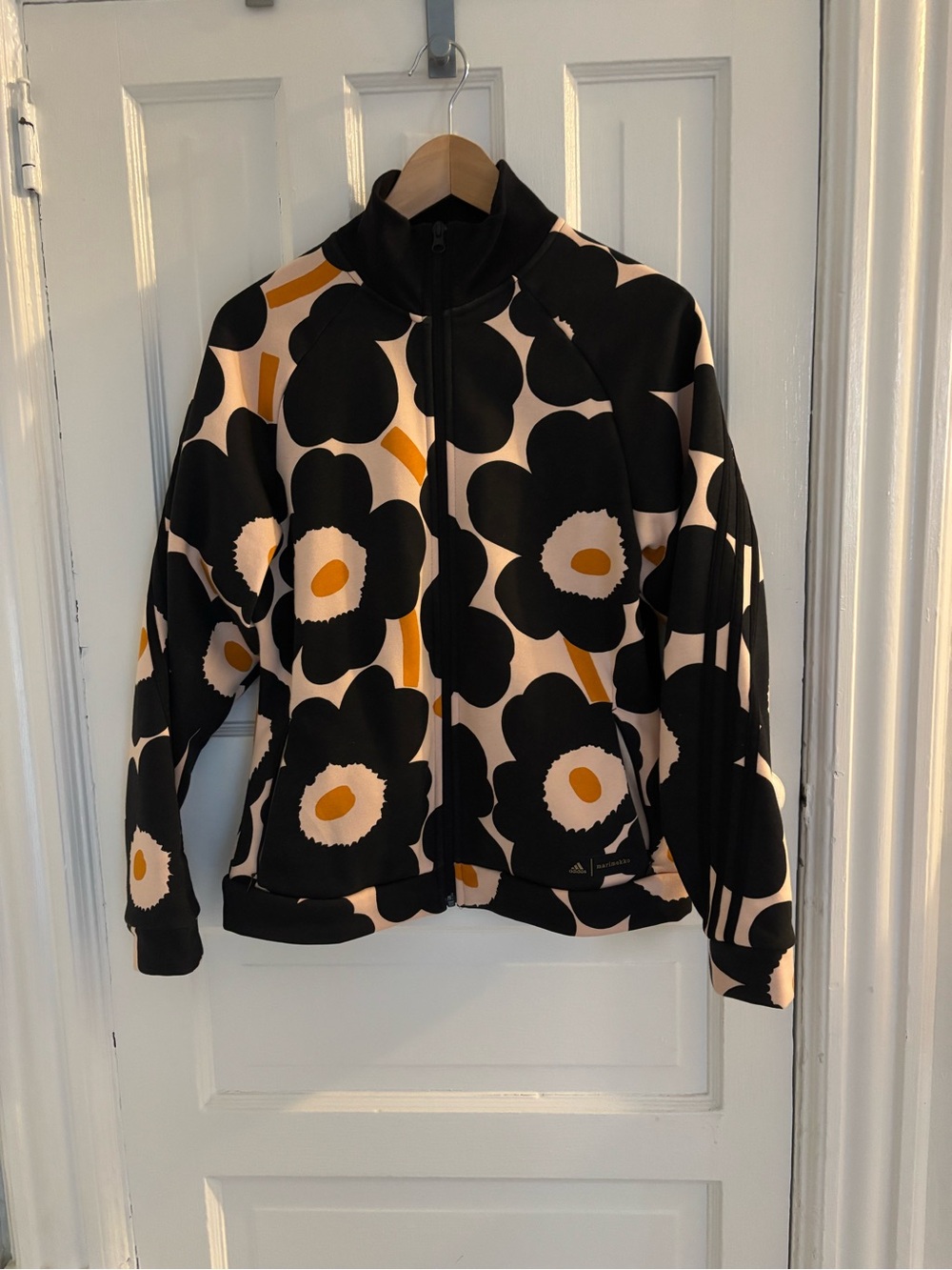 Marimekko for Adidas Collection: Black, Blush & Orange Floral Zip Track Jacket.
